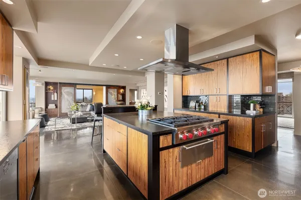 a kitchen with stainless steel appliances granite countertop a stove a sink dishwasher a oven and a refrigerator