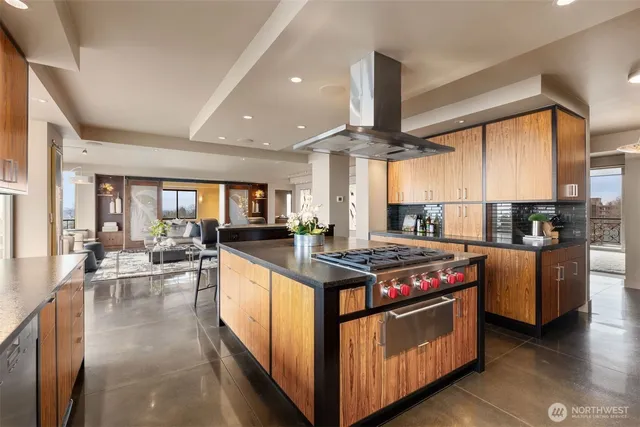 a kitchen with stainless steel appliances granite countertop a stove a sink dishwasher a oven and a refrigerator