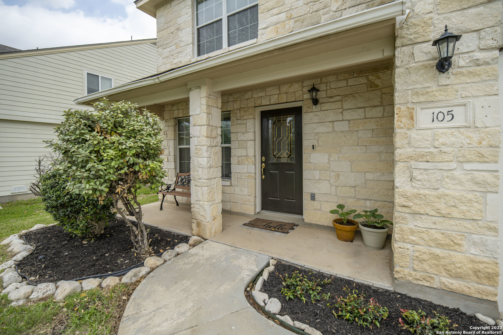 105 Hidden Cave Cibolo, TX 78108 - Photo 1 of 1 a front view of a house with a garden