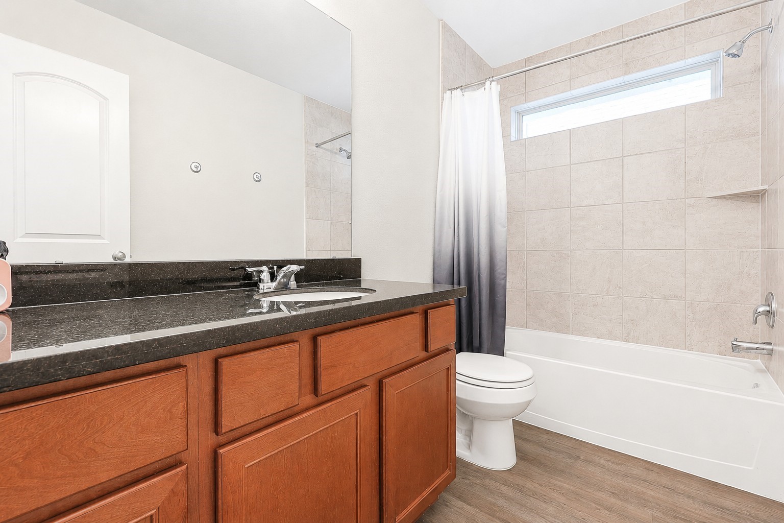 10423 Rochester Hls Lane Tomball, TX 77375 - Photo 29 of 36 This shared bathroom features the same appliances, shower and tub combination, and easy to maintain flooring.