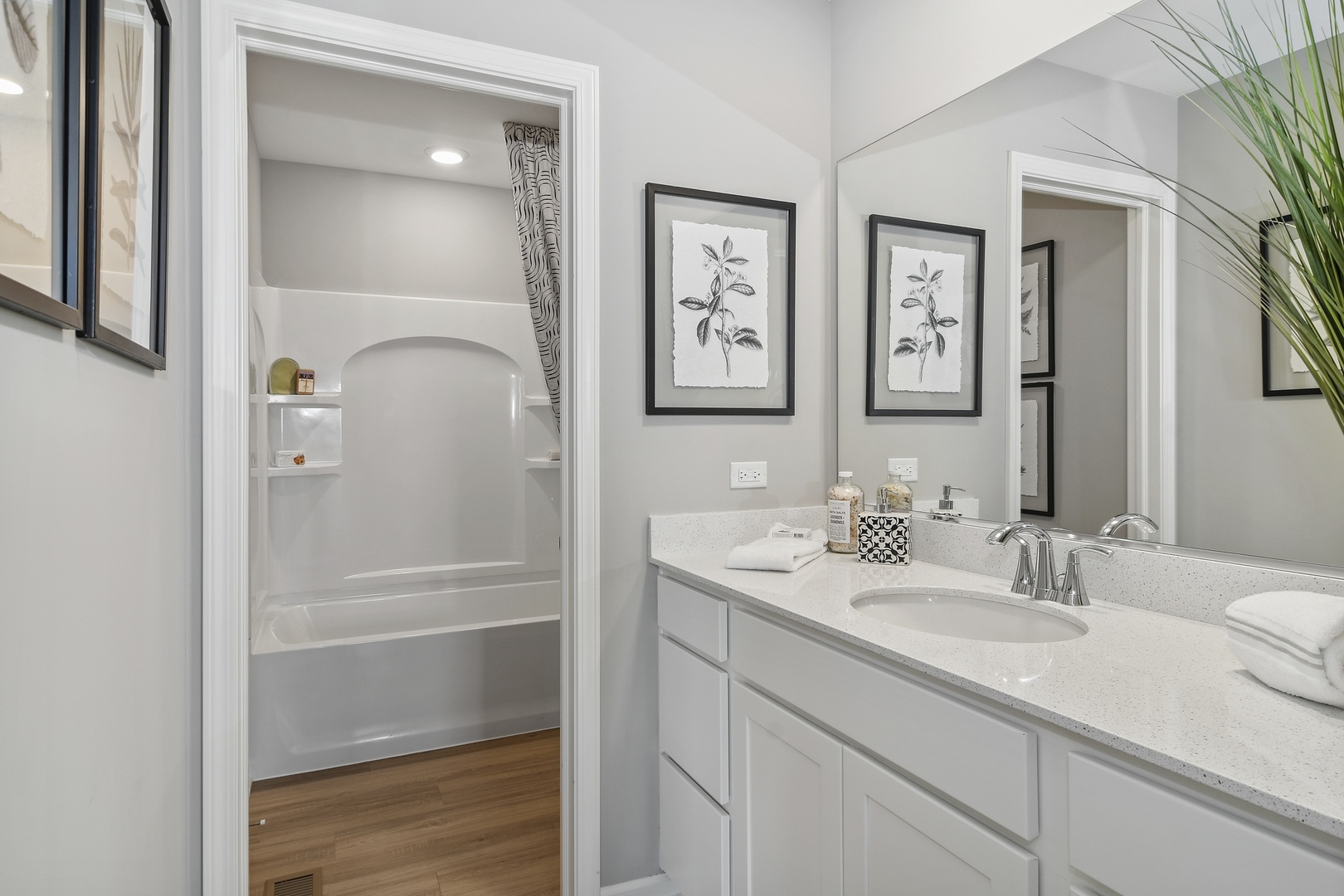 16249 Longcommon Lane Plainfield, IL 60586 - Photo 19 of 27 a bathroom with a sink and a mirror