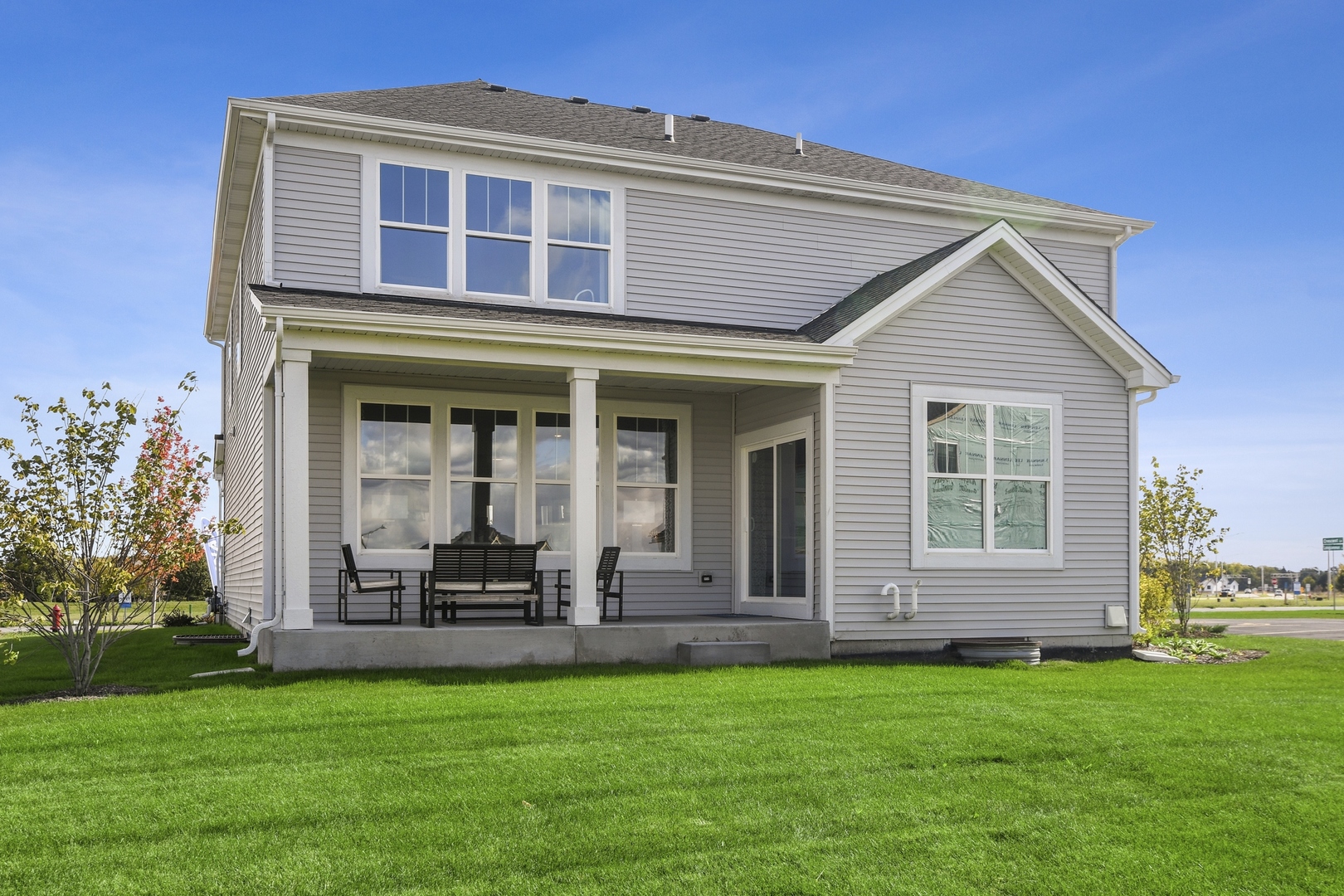 16249 Longcommon Lane Plainfield, IL 60586 - Photo 20 of 27 a front view of a house with a garden