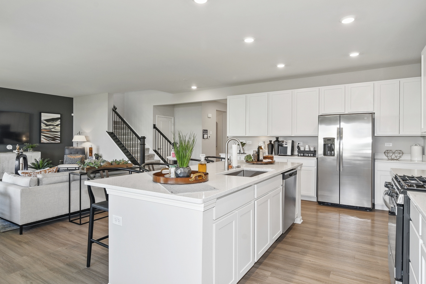 16249 Longcommon Lane Plainfield, IL 60586 - Photo 3 of 27 a view of a kitchen with appliances and wooden floor