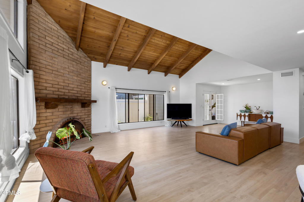 3960 West Hemlock Street Oxnard, CA 93035 - Photo 12 of 42 a living room with furniture and a fireplace