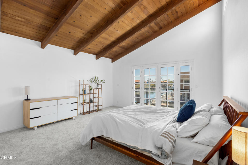 3960 West Hemlock Street Oxnard, CA 93035 - Photo 15 of 42 a bed sitting in a bedroom next to a window