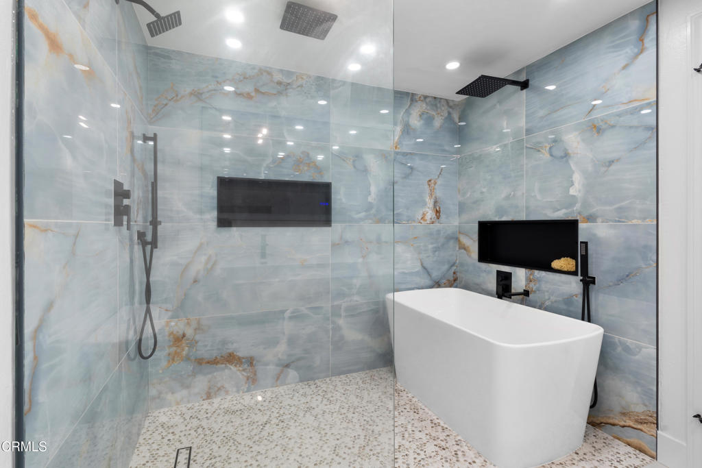 3960 West Hemlock Street Oxnard, CA 93035 - Photo 18 of 42 a bathroom with a sink a toilet and shower