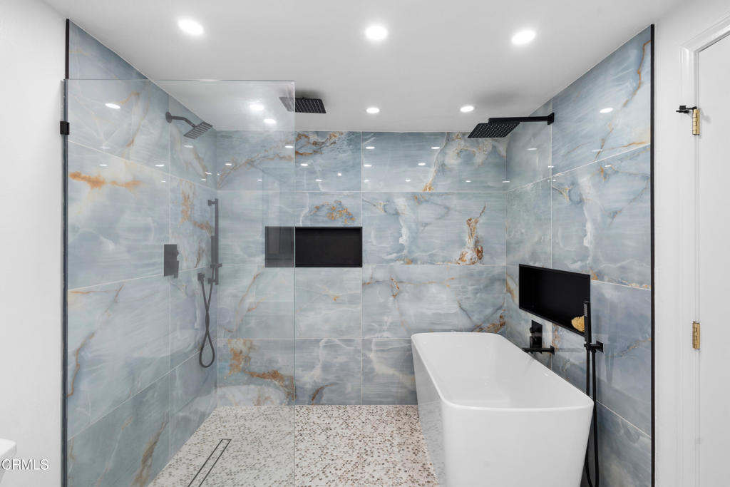 3960 West Hemlock Street Oxnard, CA 93035 - Photo 39 of 42 a bathroom with a sink a toilet and shower