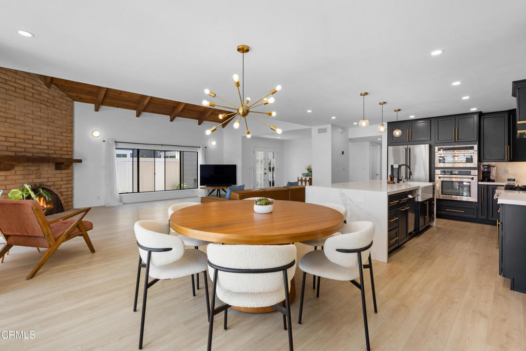 3960 West Hemlock Street Oxnard, CA 93035 - Photo 7 of 42 a large kitchen with a table and chairs