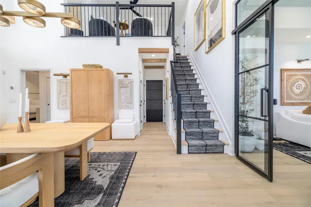 a view of a kitchen with furniture and staircase