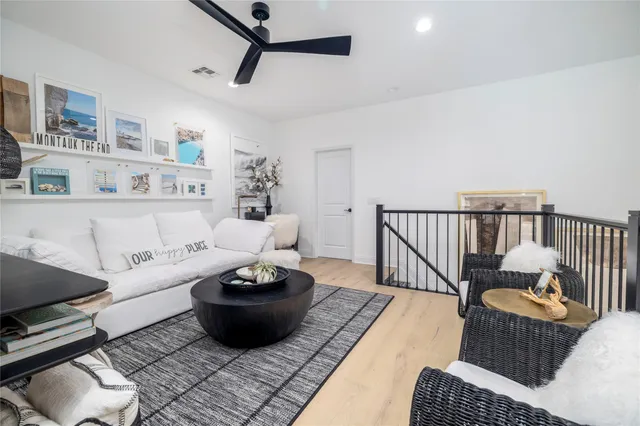 a living room with furniture and a rug