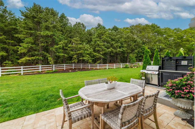 a view of a chairs and table in the garden
