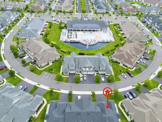 an aerial view of a house yard swimming pool and outdoor space