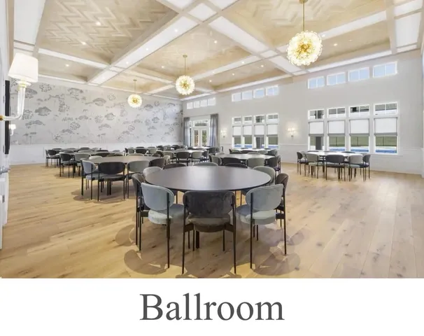 a kitchen with a dining table wooden floor and a clock