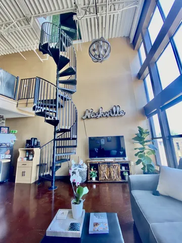 a living room with furniture and a table
