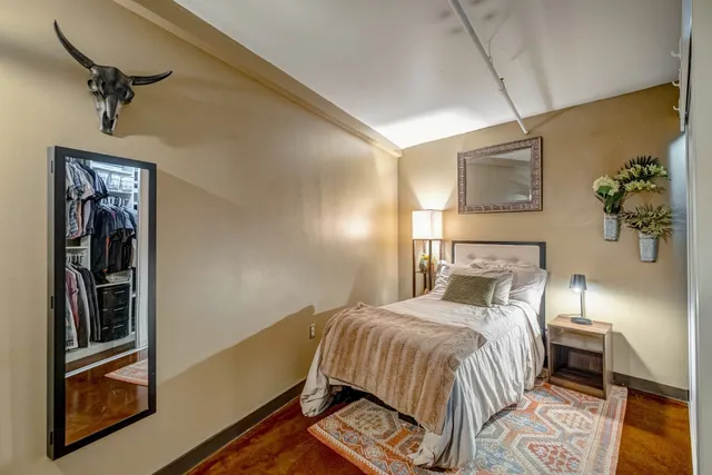 a bedroom with a bed and a walk in closet