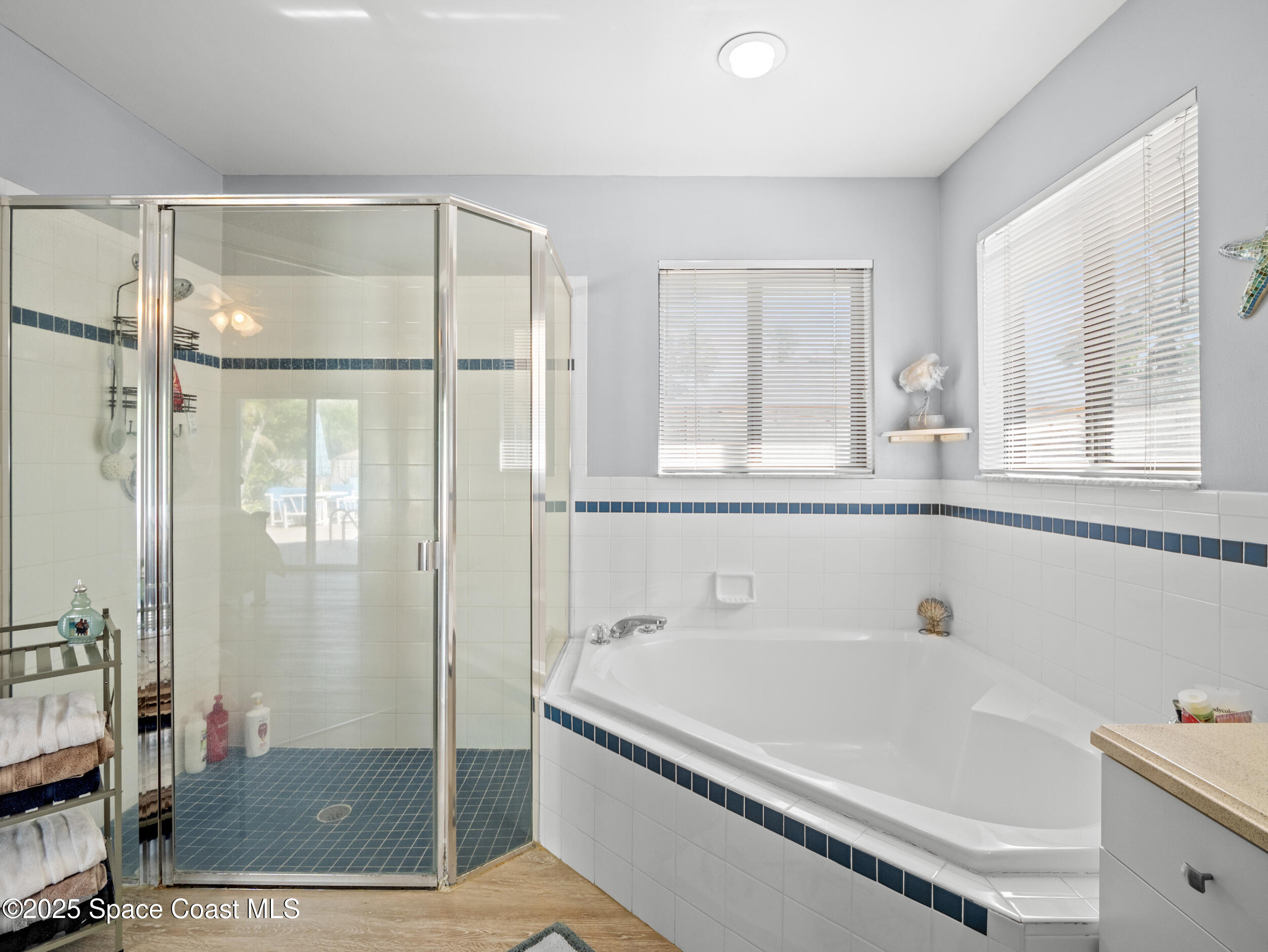 230 Riggs Avenue Melbourne Beach, FL 32951 - Photo 17 of 38 a bathroom with a bathtub and a shower