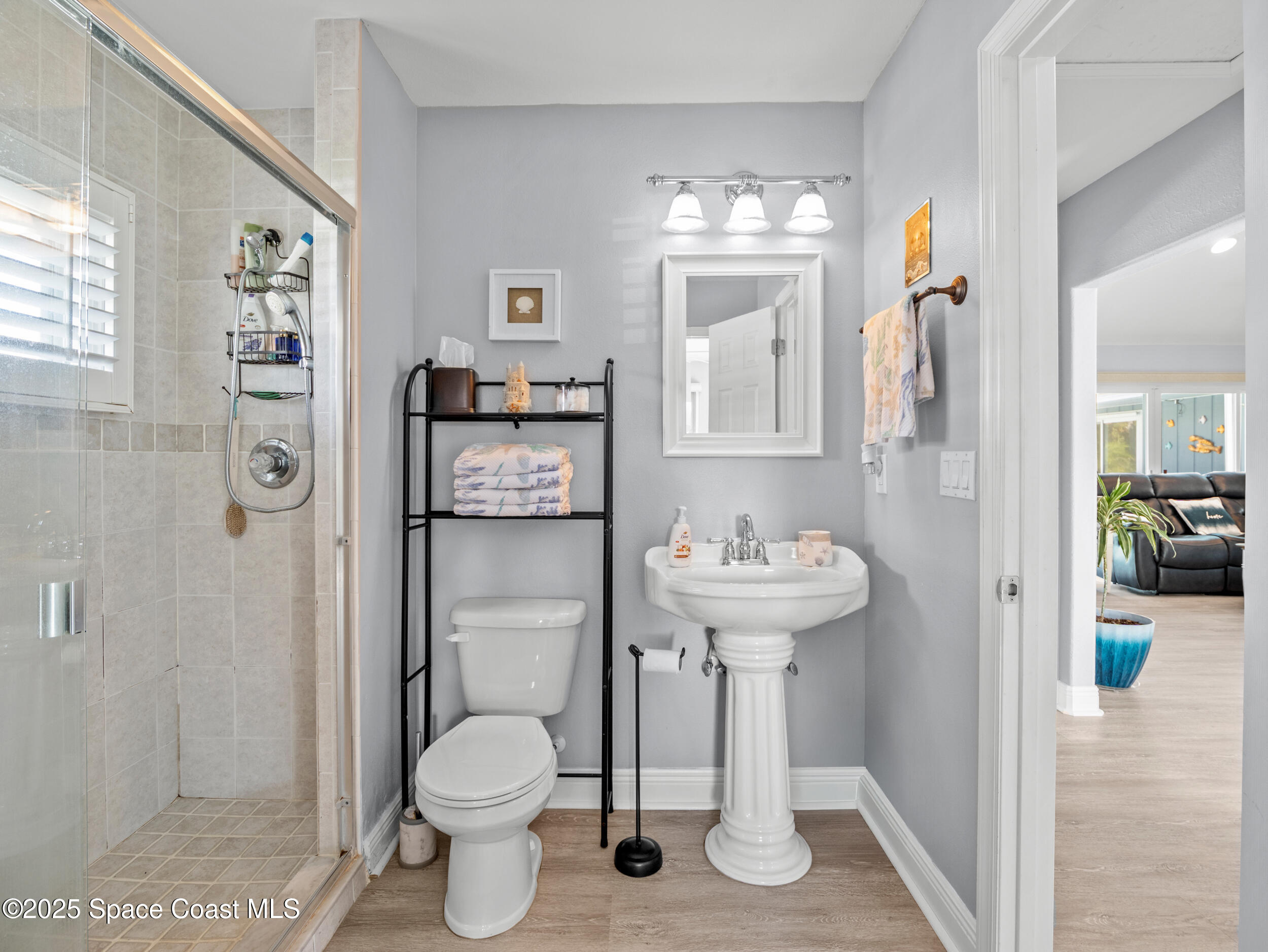 230 Riggs Avenue Melbourne Beach, FL 32951 - Photo 20 of 38 a bathroom with a sink toilet and shower