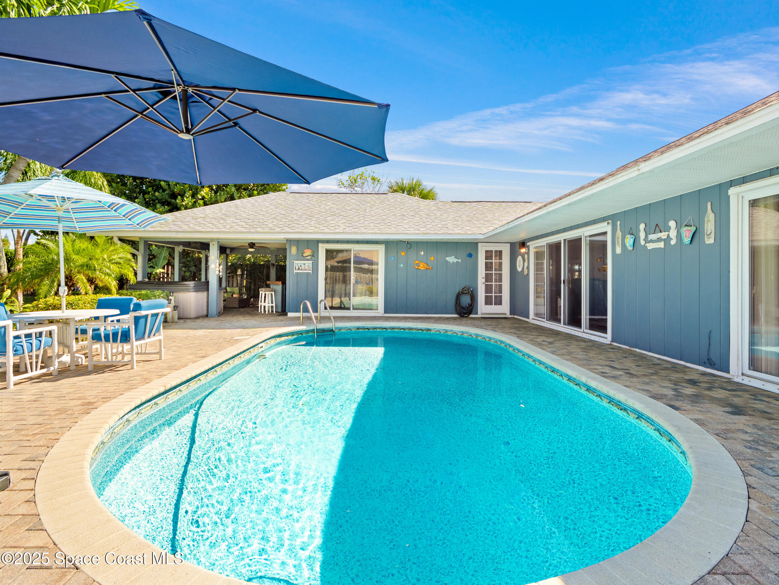 230 Riggs Avenue Melbourne Beach, FL 32951 - Photo 26 of 38 an outdoor space with swimming pool having patio