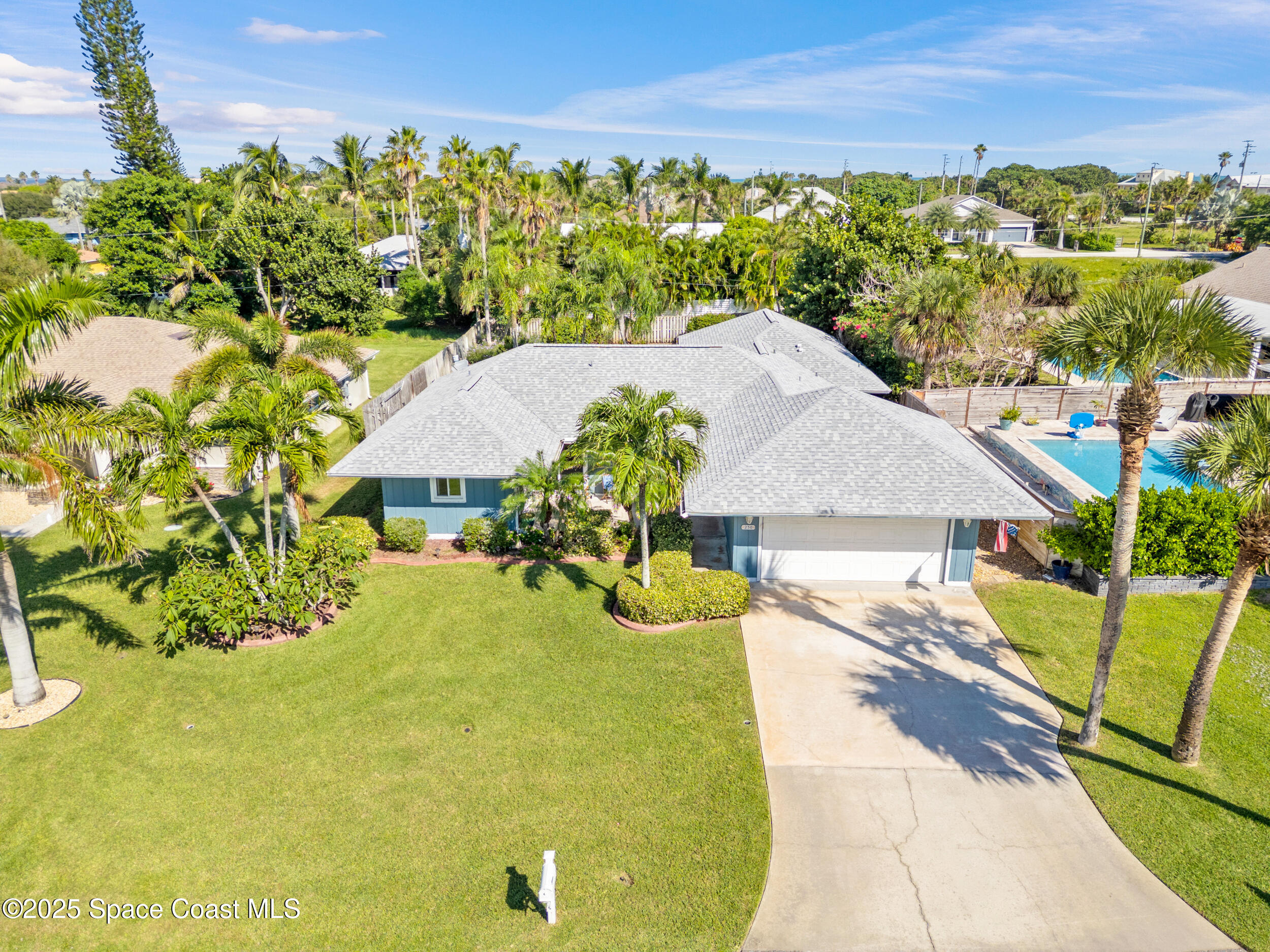230 Riggs Avenue Melbourne Beach, FL 32951 - Photo 27 of 38 a view of a house with a yard