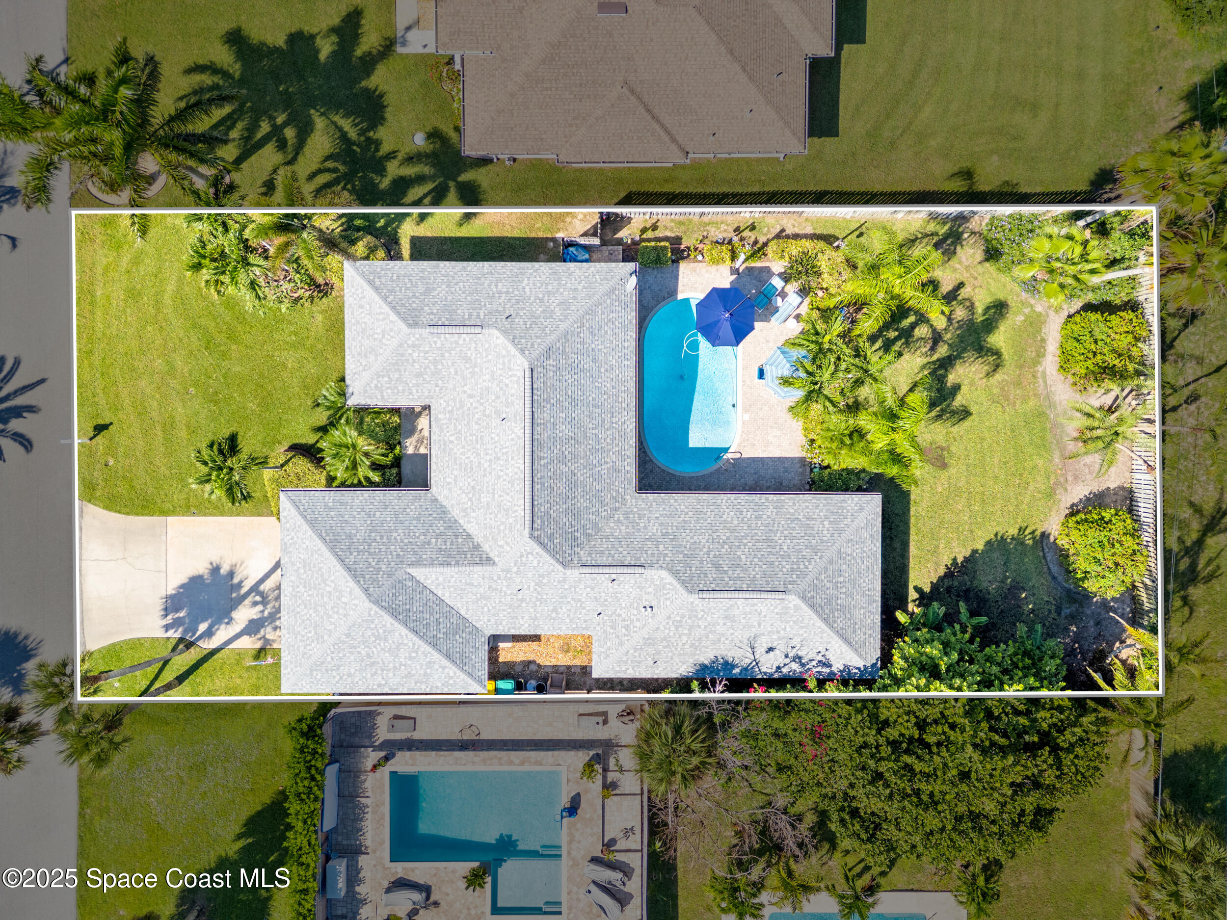 230 Riggs Avenue Melbourne Beach, FL 32951 - Photo 29 of 38 an aerial view of a house with a swimming pool