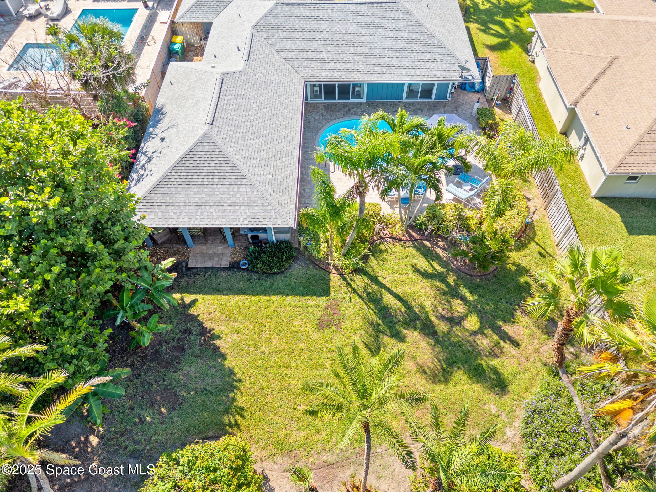 230 Riggs Avenue Melbourne Beach, FL 32951 - Photo 31 of 38 a view of a house with a yard