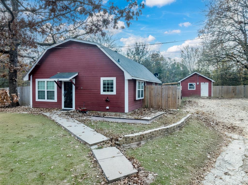 Barn style home with newer roof and fully fenced yard