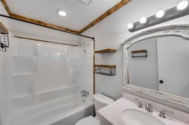 a bathroom with a bathtub and a sink