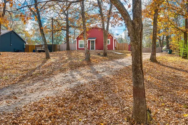 a view of house with yard