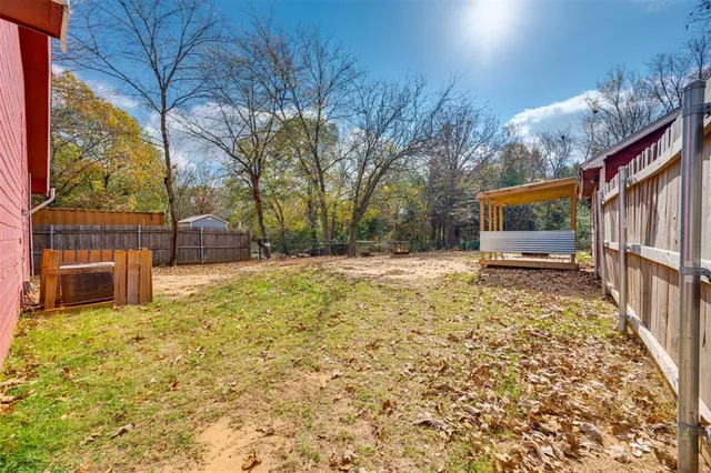 a view of backyard with outdoor seating