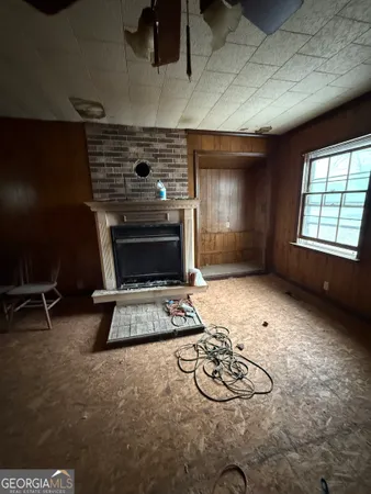 a room with furniture and a fireplace
