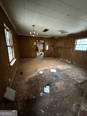 a front view of a house with trees