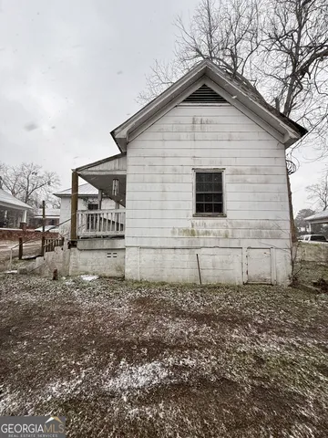 a house with trees in the background