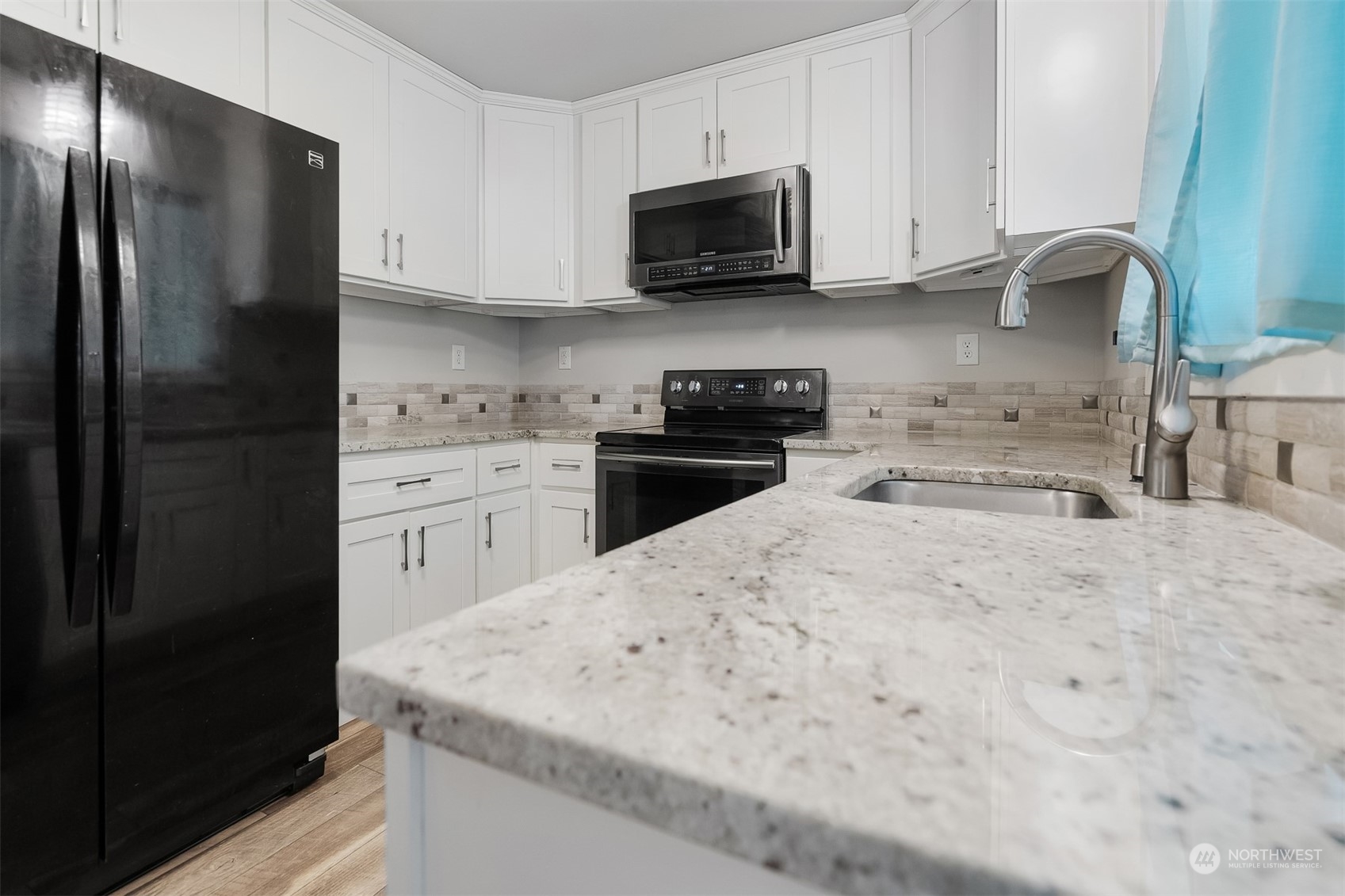 730 Tipsoo Loop South Rainier, WA 98576 - Photo 12 of 35 a kitchen with stainless steel appliances granite countertop a refrigerator stove top oven a sink and dishwasher