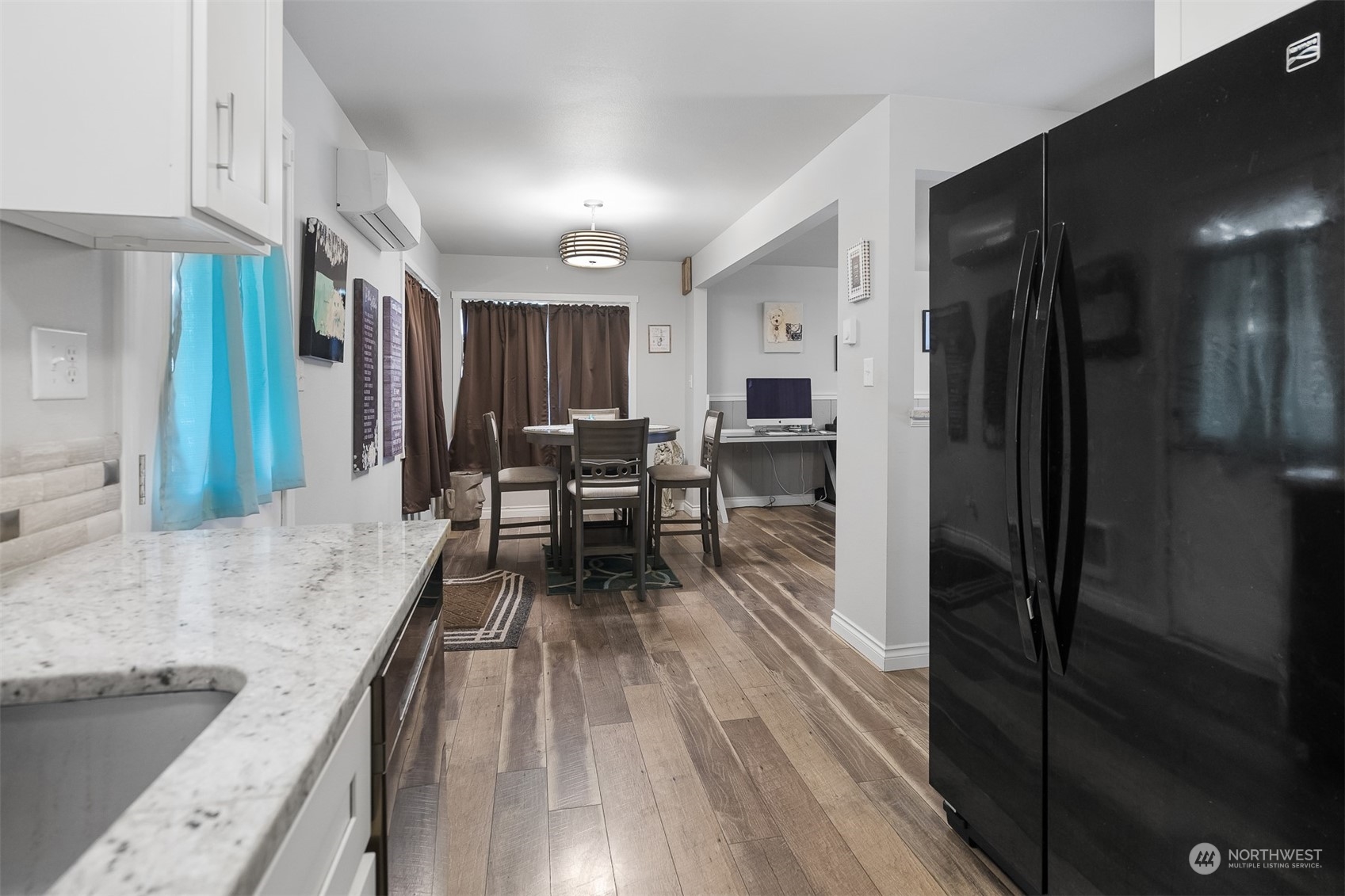 730 Tipsoo Loop South Rainier, WA 98576 - Photo 13 of 35 a view of a kitchen with kitchen island granite countertop wooden floor and stainless steel appliances