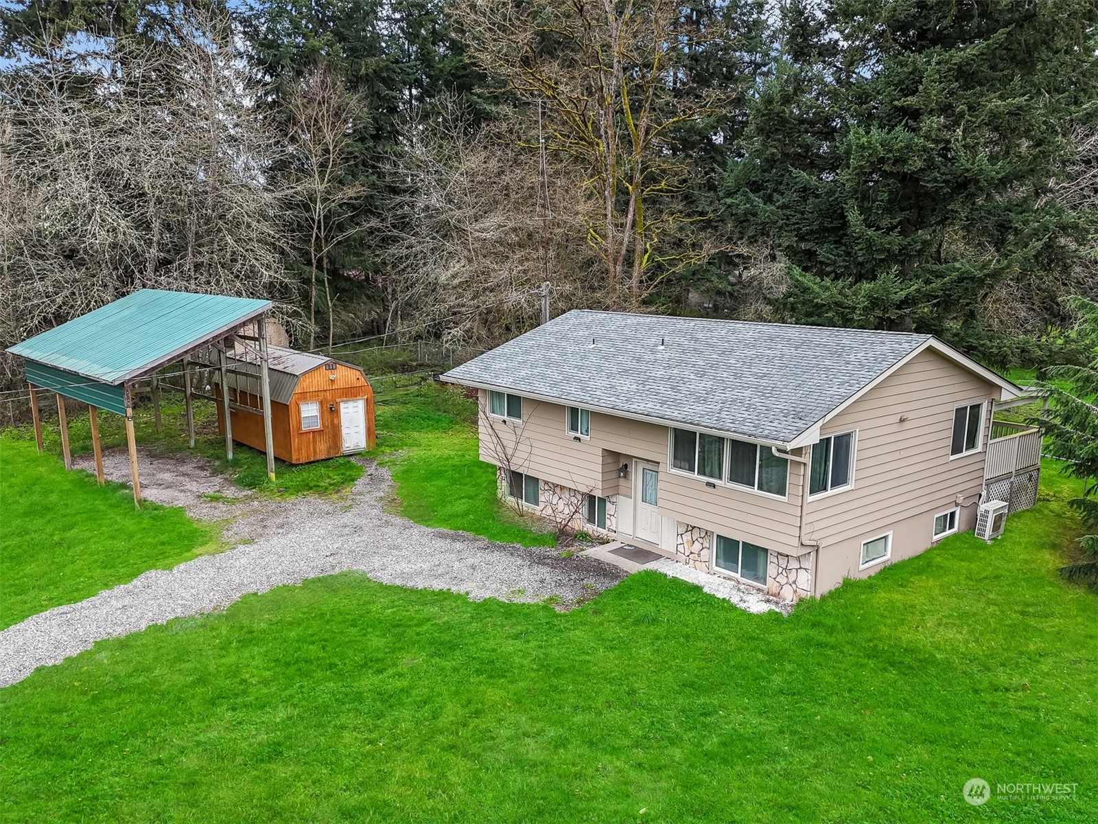 730 Tipsoo Loop South Rainier, WA 98576 - Photo 2 of 35 a aerial view of a house with a yard table and chairs