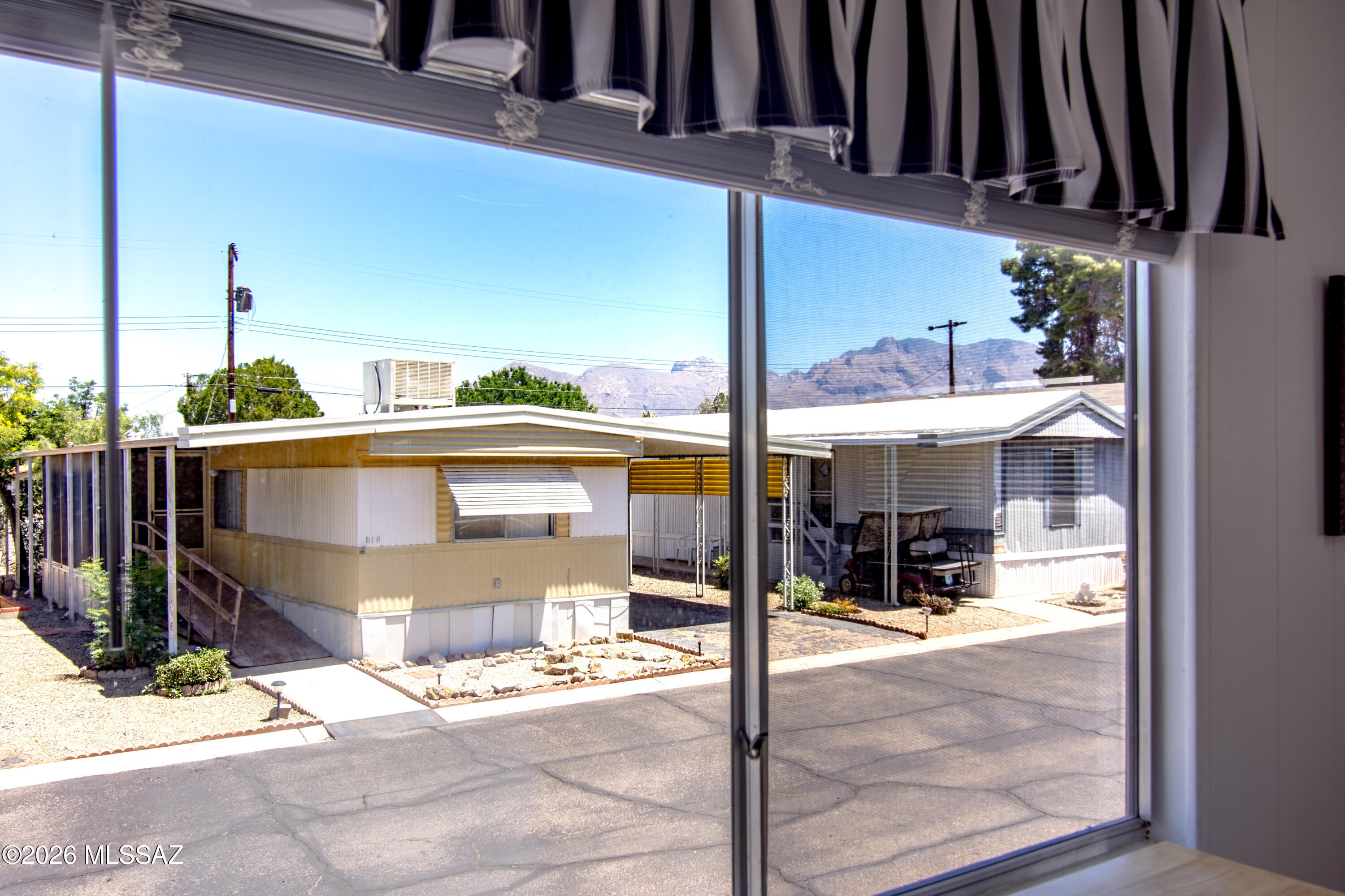 4550 North Flowing Wells Road, Unit 155 Tucson, AZ 85705 - Photo 15 of 40 a view of a building with sitting area