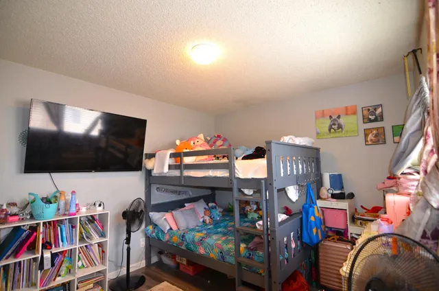 a living room with lots of furniture and a flat screen tv