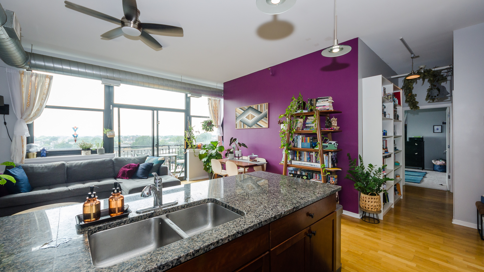 2323 West Pershing Road, Unit 602 Chicago, IL 60609 - Photo 11 of 29 a kitchen with granite countertop a stove and a sink