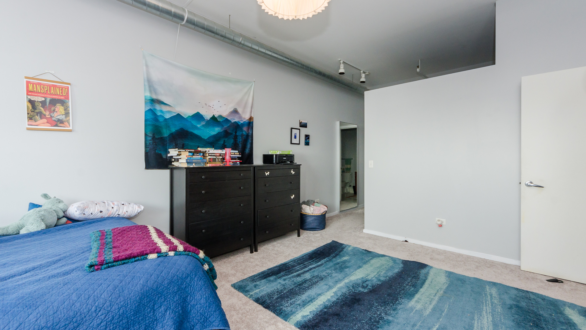 2323 West Pershing Road, Unit 602 Chicago, IL 60609 - Photo 15 of 29 a bedroom with a bed and wooden floor