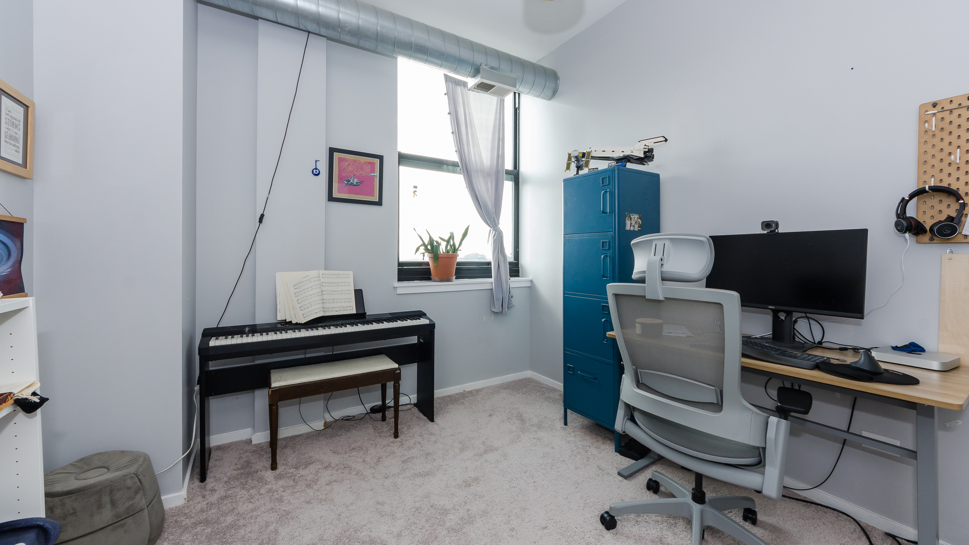 2323 West Pershing Road, Unit 602 Chicago, IL 60609 - Photo 17 of 29 a view of a workspace with furniture and a window