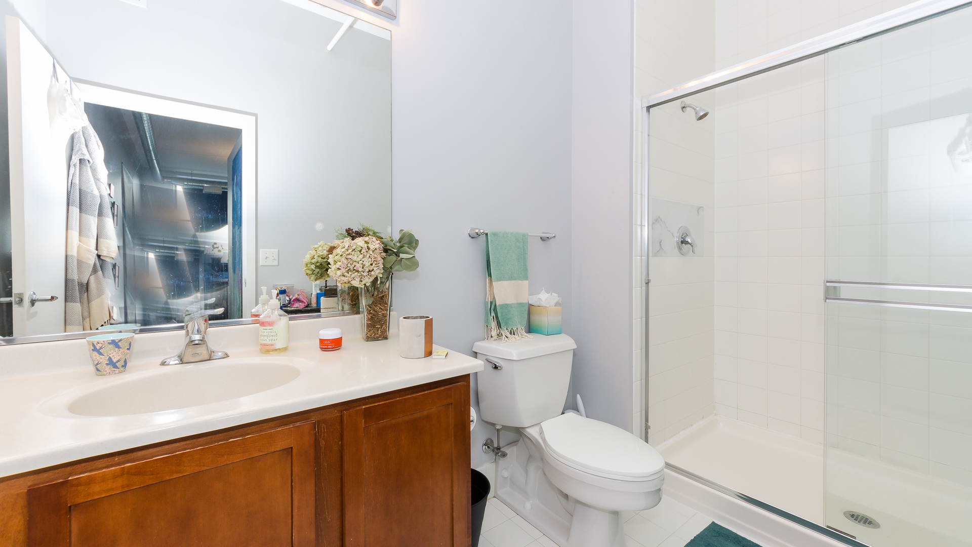 2323 West Pershing Road, Unit 602 Chicago, IL 60609 - Photo 20 of 29 a bathroom with a sink toilet and shower