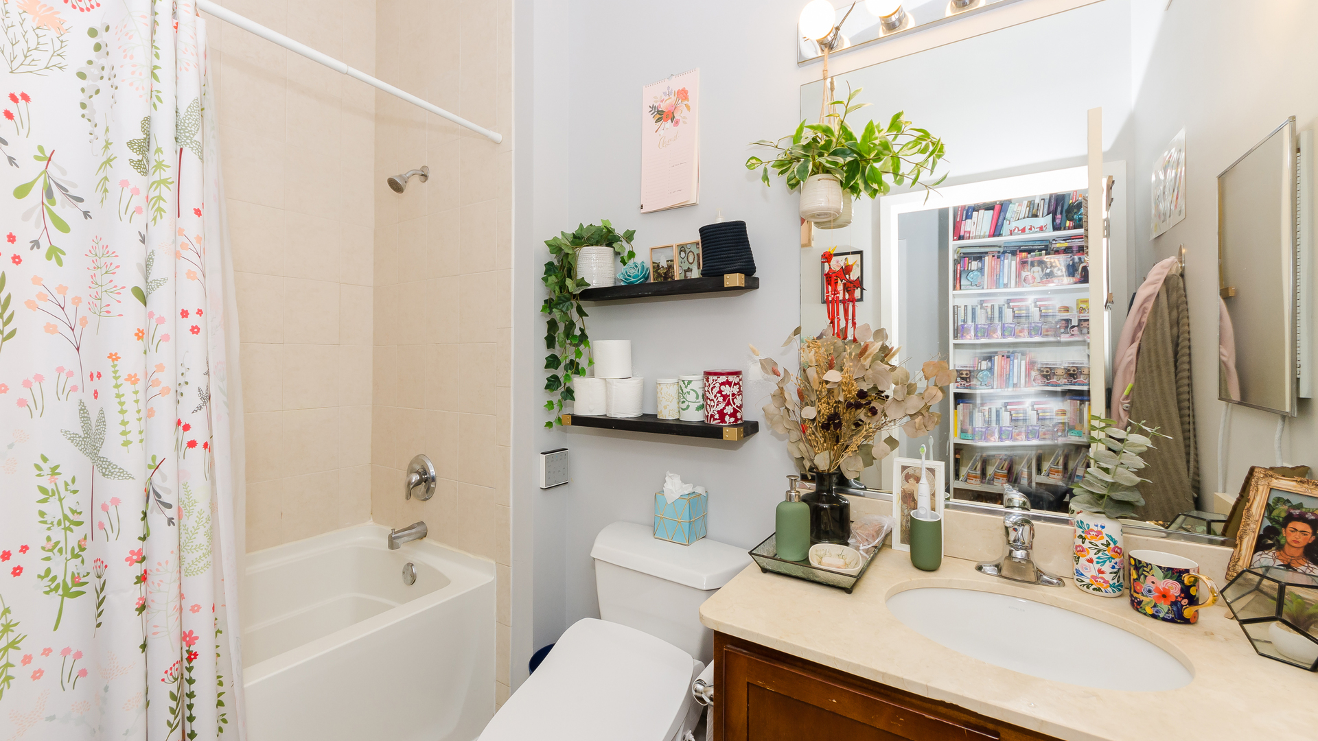 2323 West Pershing Road, Unit 602 Chicago, IL 60609 - Photo 21 of 29 a bathroom with a sink vanity mirror and tub