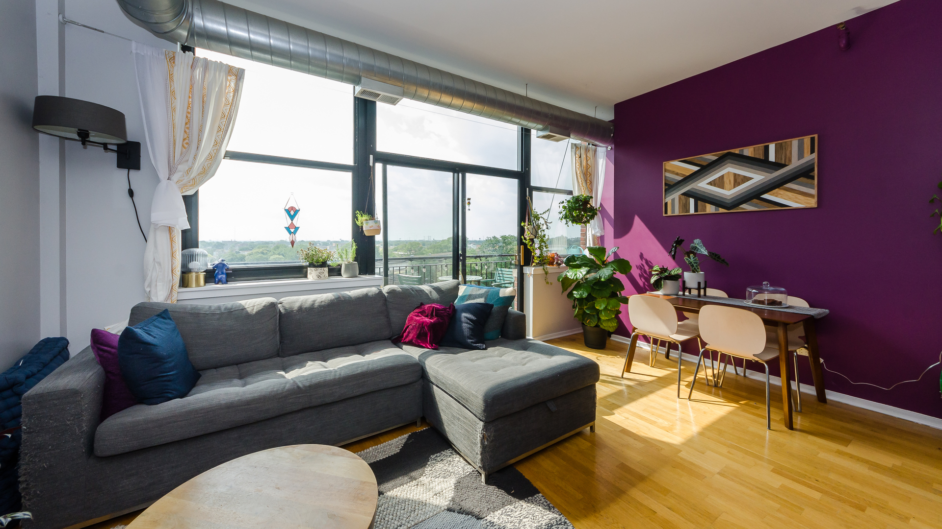 2323 West Pershing Road, Unit 602 Chicago, IL 60609 - Photo 6 of 29 a living room with furniture and a floor to ceiling window