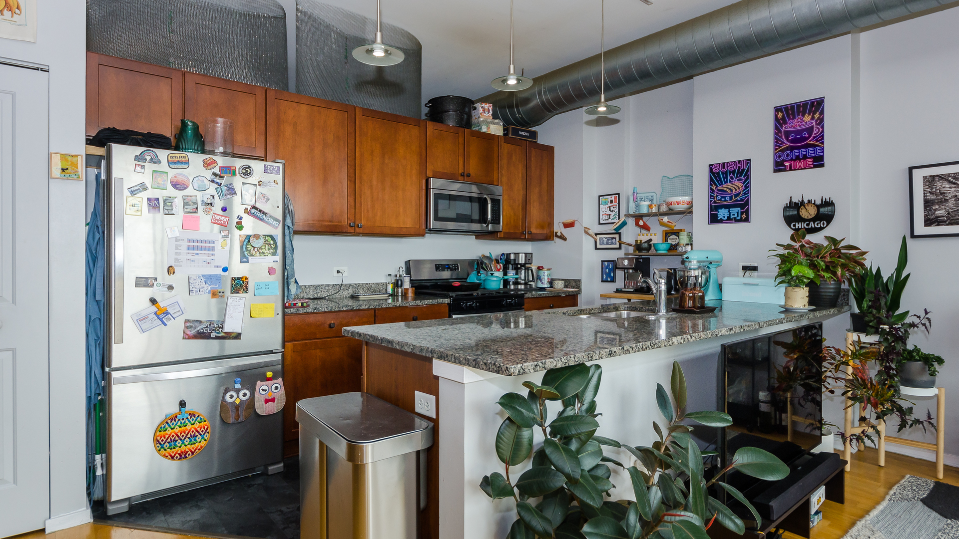 2323 West Pershing Road, Unit 602 Chicago, IL 60609 - Photo 8 of 29 a kitchen with stainless steel appliances a sink a counter top space and a window