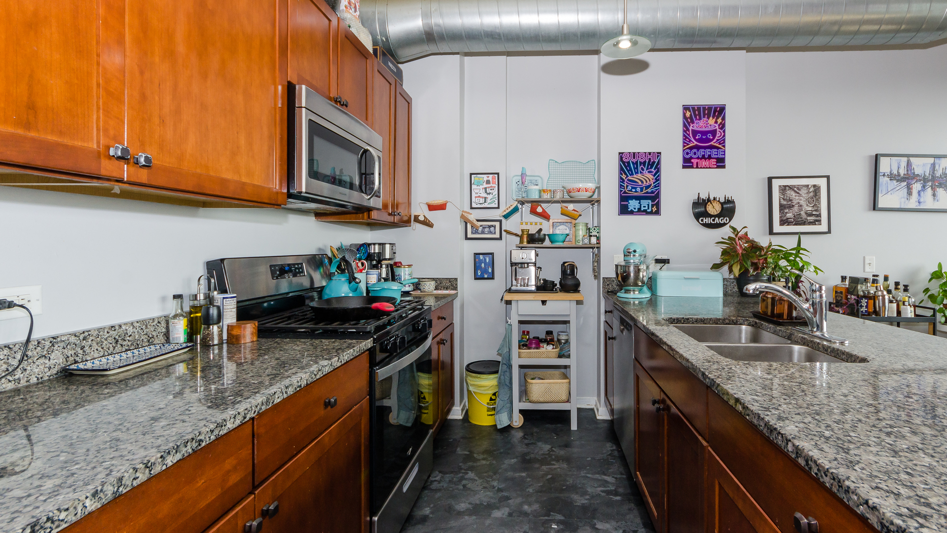 2323 West Pershing Road, Unit 602 Chicago, IL 60609 - Photo 9 of 29 a kitchen with granite countertop lots of counter top space stainless steel appliances and cabinets