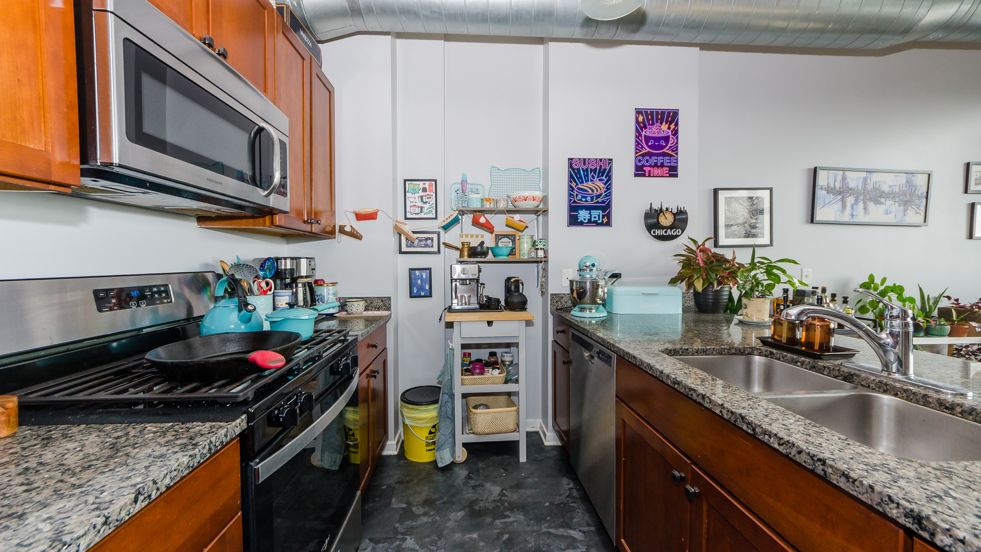 2323 West Pershing Road, Unit 602 Chicago, IL 60609 - Photo 10 of 29 a kitchen with stainless steel appliances granite countertop a sink stove and microwave