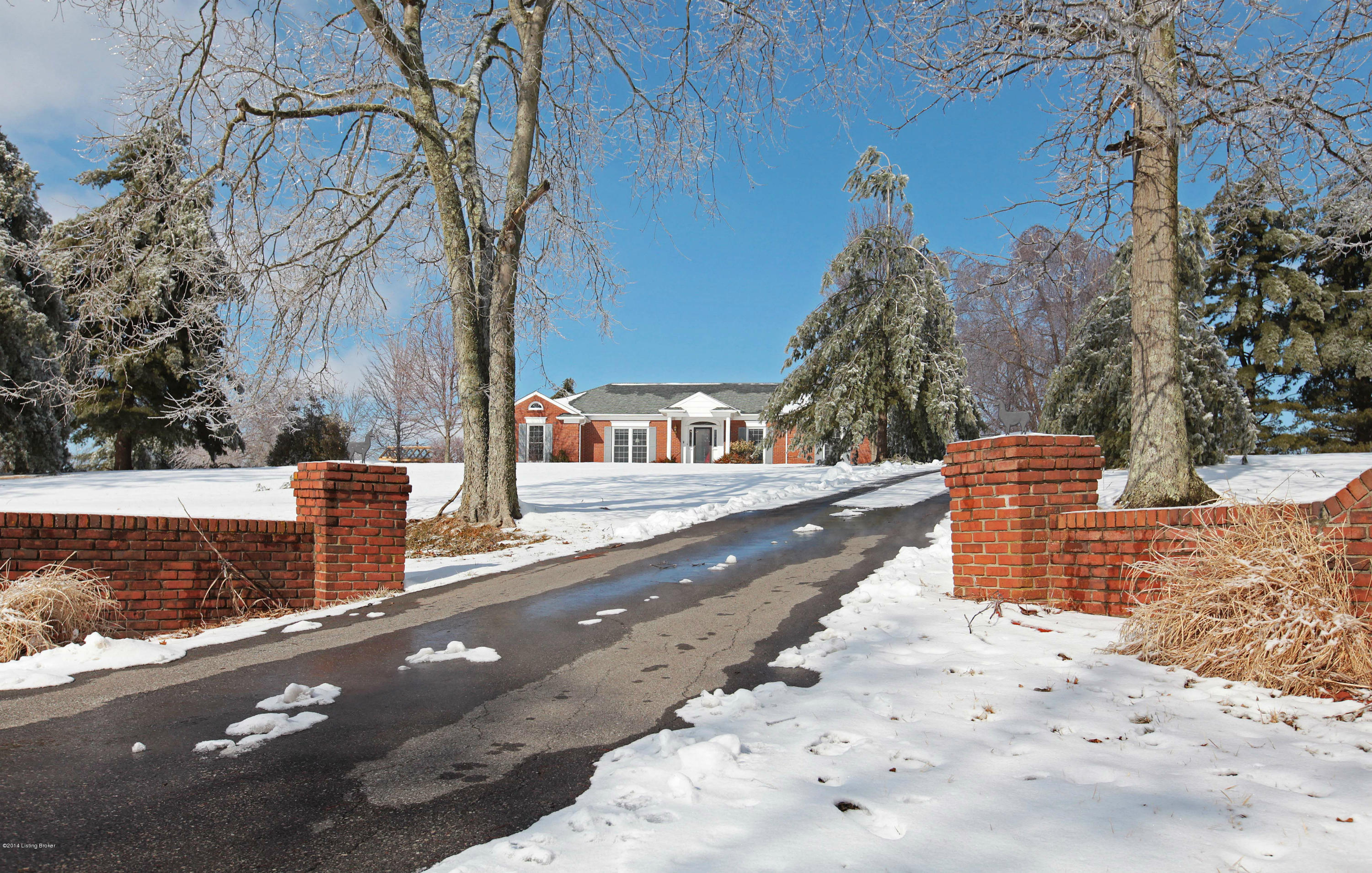 4 Lincoln Run Road Louisville, KY 40245 - Photo 2 of 36 Matching brick entrance frames drive way leading to house.