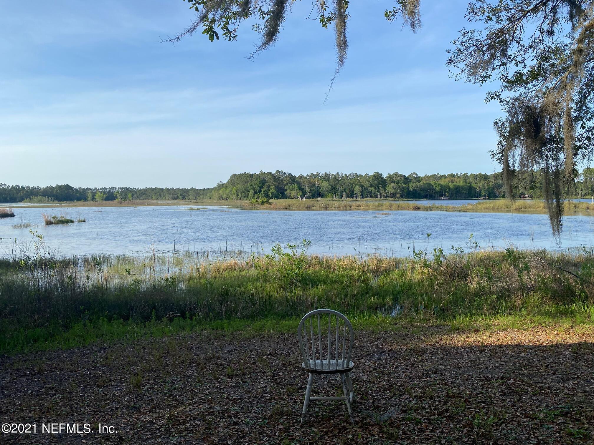 196 Indian Lakes Road Hawthorne, FL 32640 - Photo 11 of 27 a view of lake with mountain in the back