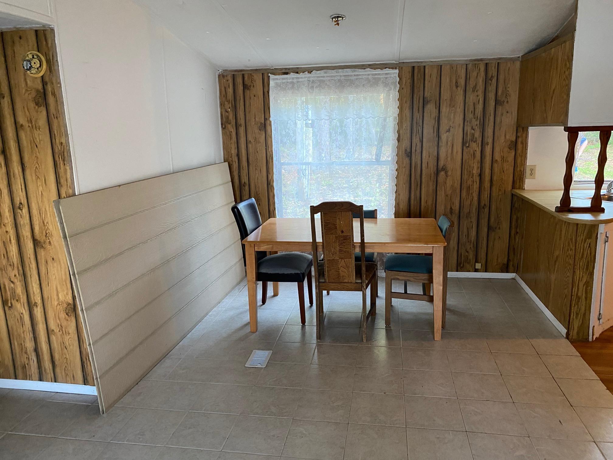 196 Indian Lakes Road Hawthorne, FL 32640 - Photo 23 of 27 a view of a dining room with furniture and window