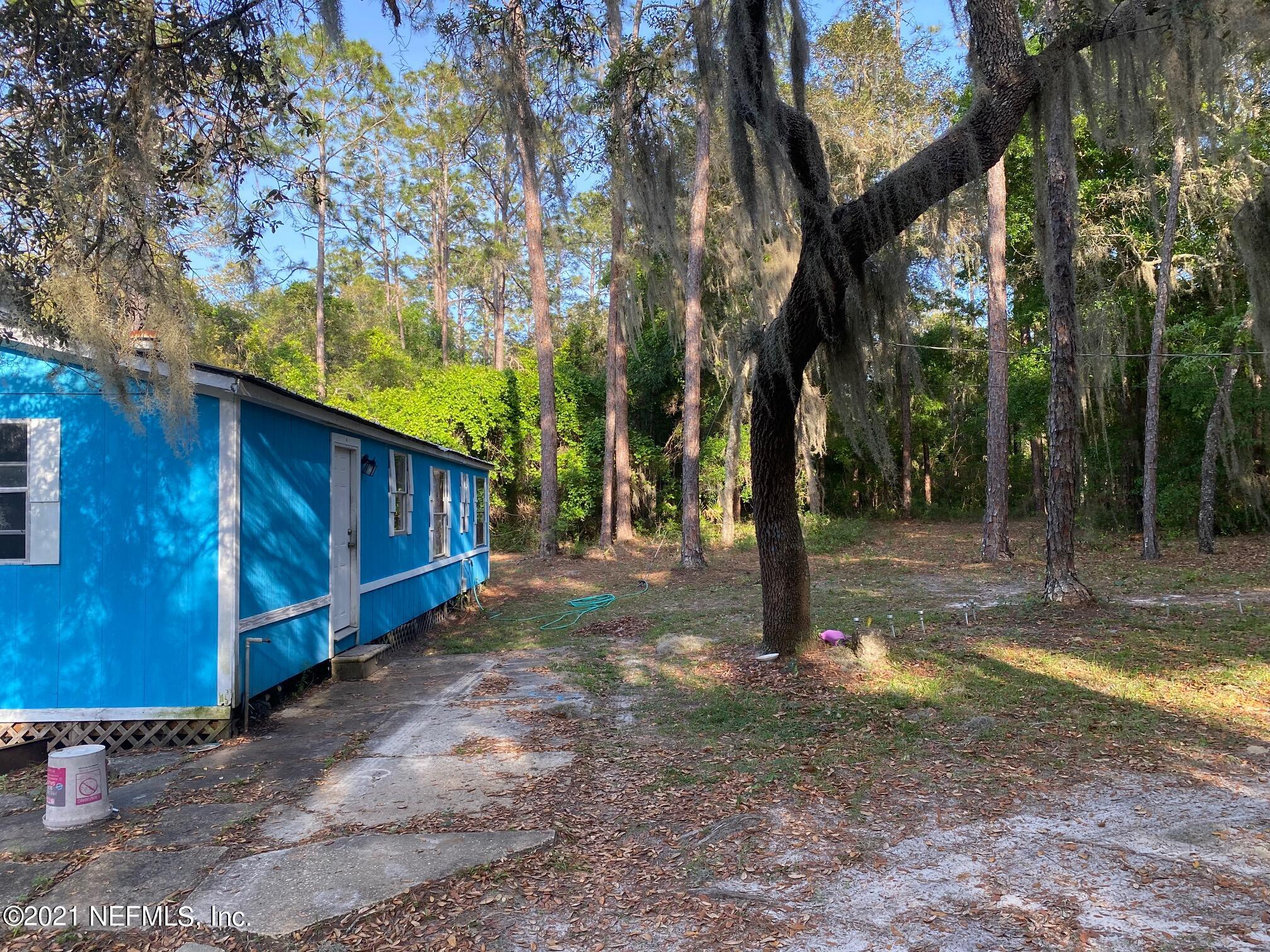 196 Indian Lakes Road Hawthorne, FL 32640 - Photo 6 of 27 a view of a yard with trees